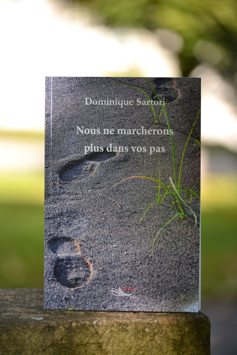 clear hour glass beside pink flowers